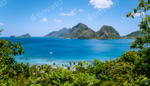 Preview: El Nido, Palawan, Philippines. Yacht boat in the sea bay near Las Cabanas beach. Rocky mountains in