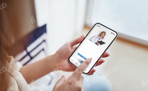 Preview: Female exploring options on health app via her smartphone at home
