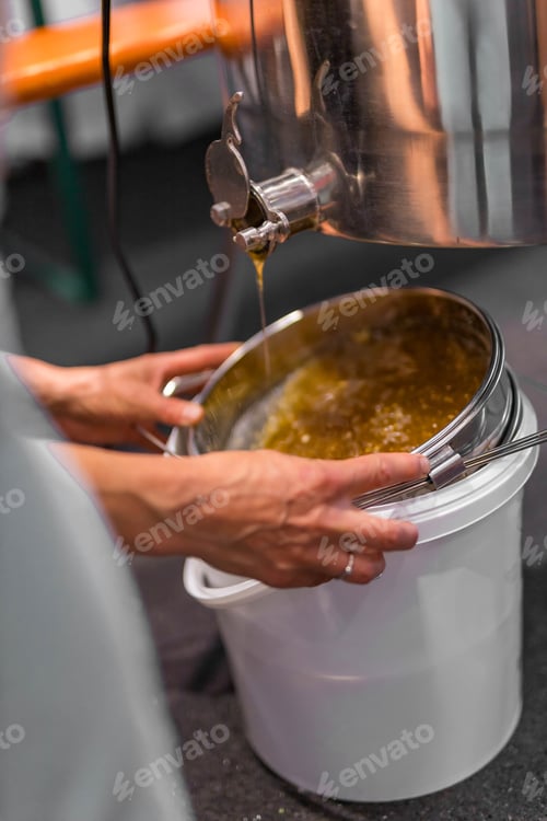 Preview: Machinery and equipment for beekeeping. Drip fresh honey into a bucket