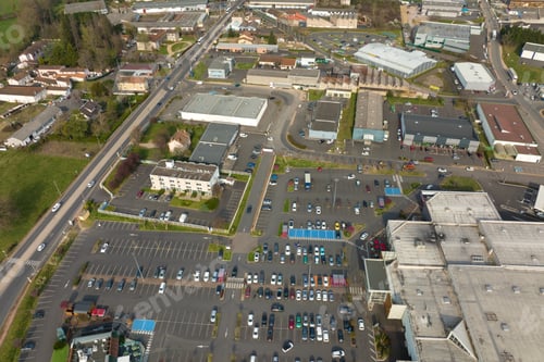 Preview: Aerial view of many colorful cars parked on parking lot with lines and markings for parking