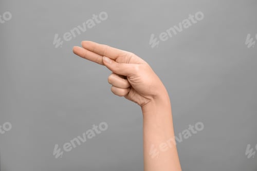 Preview: Woman showing H letter on grey background, closeup. Sign language