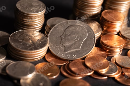 Preview: A stack of dollar coins stacked on each other in different positions. Money