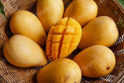 Preview: yellow ripe mangoes in basket