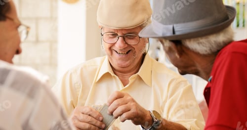 Preview: Group Of Happy Seniors Playing Cards Game