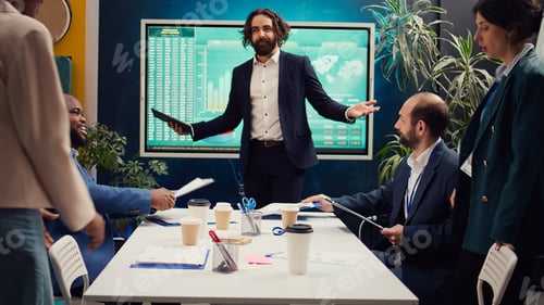 Preview: Chief executive officer greeting his employees in a boardroom
