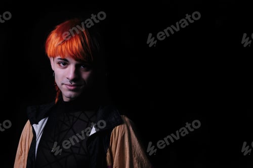 Preview: Boy with orange hair on the black background.