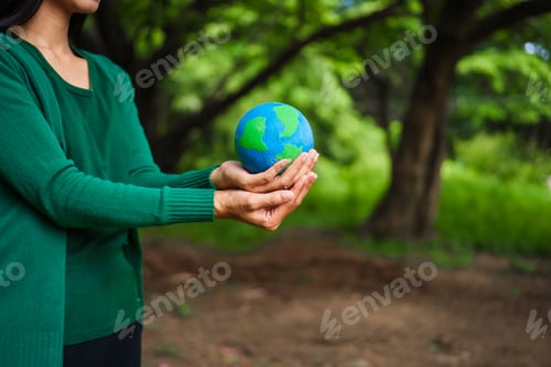 Preview: A male hand holds a hammer, symbolizing the enforcement of tree conservation laws. This highlights