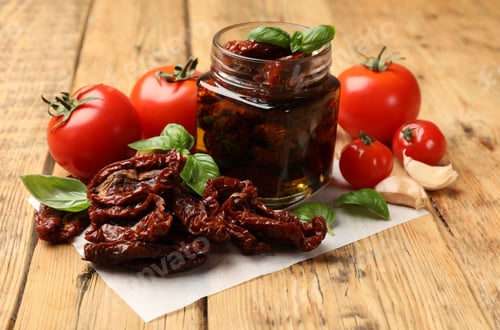 Preview: Tasty sun dried tomatoes and fresh vegetables on wooden table, closeup