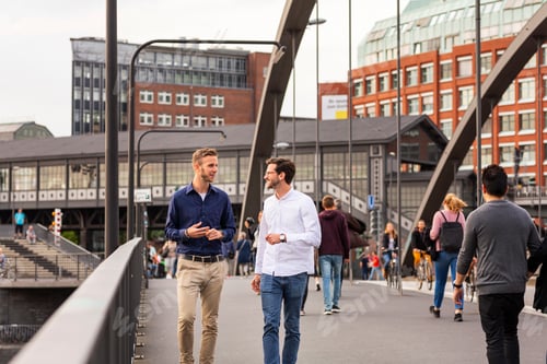 Preview: Men walking on bridge and talking