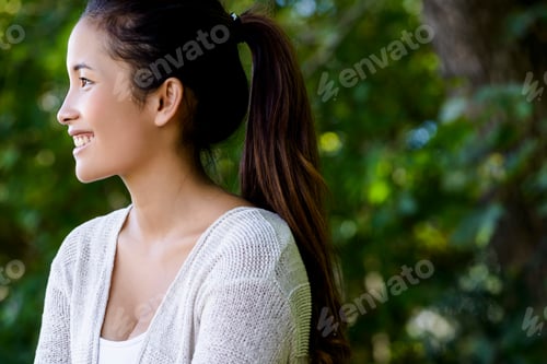 Preview: Portrait of beautiful young woman in park