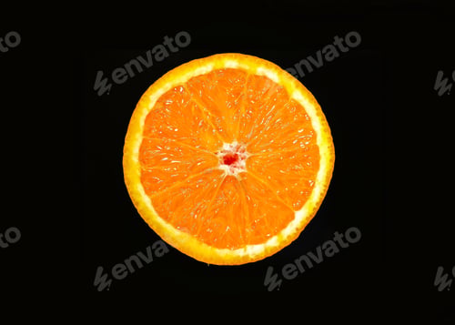 Preview: Orange slice isolated on a dark background