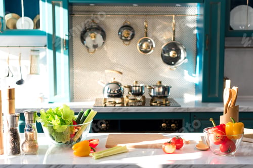 Preview: fresh vegetables and spices on table in empty kitchen