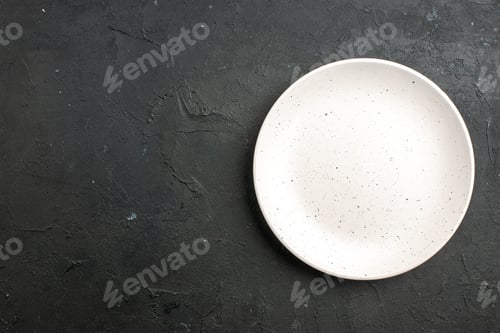 Preview: top view white salad plate on dark table with free space
