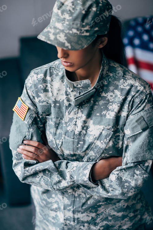Preview: african american female soldier in military uniform with usa flag emblem