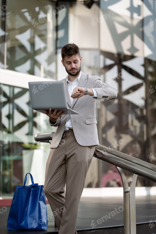 Preview: Portrait of a successful businessman male using smartphone