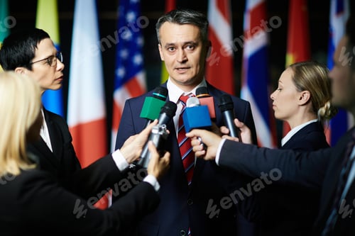 Man Answers Press Questions at a Corporate Event