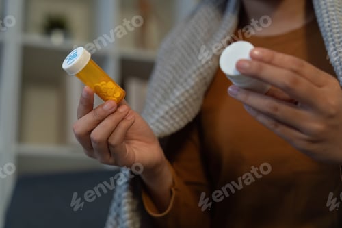 Preview: Medication Management. Individual holding prescription bottle and cap.