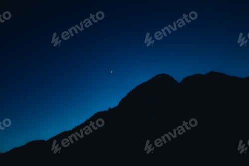 Preview: Beautiful night sky behind dark hills