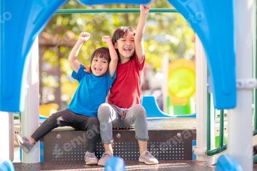 Preview: Child playing on the outdoor playground. Kids play in school or kindergarten yard.