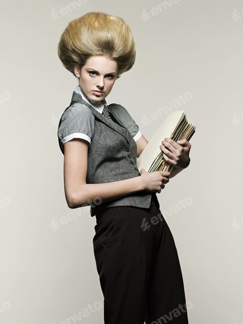 Preview: Businesswoman holding files
