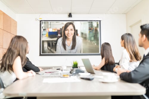 Preview: Colleagues Watching Presentation In Meeting Room