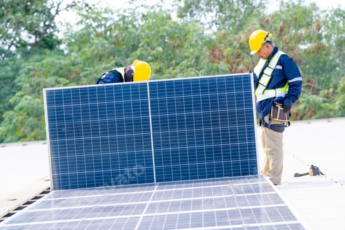 Preview: workers installing solar panels, for efficient energy on rooftop