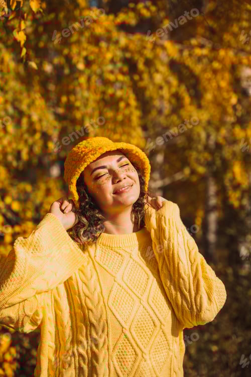Preview: Woman in Yellow Sweater and Hat in Autumn