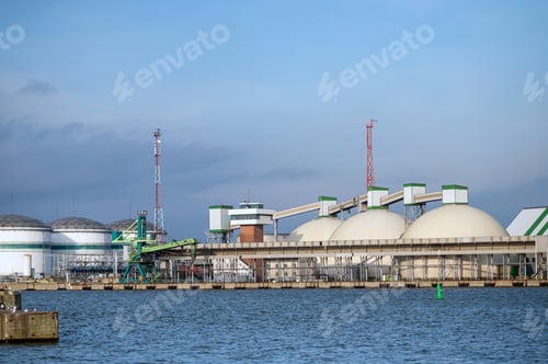 Preview: Industrial landscape with oil storage tanks on the seashore.