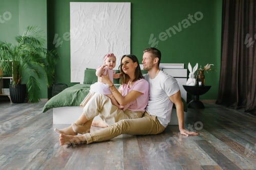 Preview: Loving Parents With Baby Girl In Cozy Bedroom