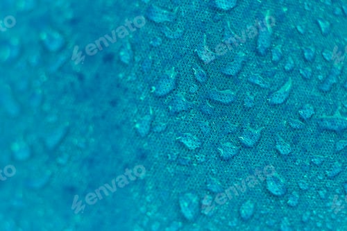 Preview: water beading on fabric. Waterproof coating background with water drops