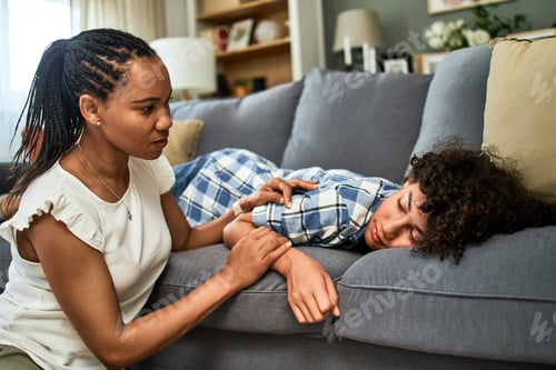 Preview: Caring mother comforting her teenage son.