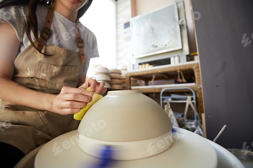 Preview: Female Potter Working with Wheel