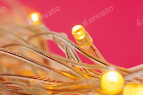 Preview: Illuminated garland lights on bright pink background