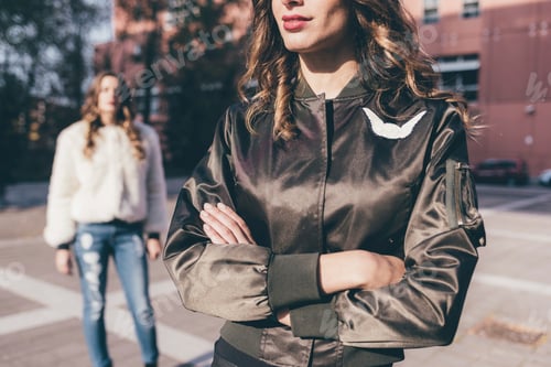 Preview: Stylish Women Posing Outdoors in Urban Setting
