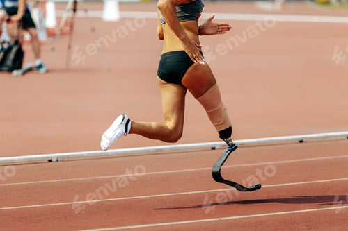 Preview: female para athlete on prosthetic leg running track stadium, summer para athletics championships