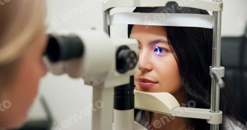 Preview: Woman, optometry and slit lamp for test, vision or care for wellness assessment with health in clin