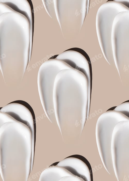 Preview: cosmetic smears of creamy texture on a pastel beige background