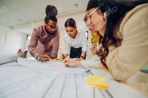 Preview: Multiracial team of engineers or architects having a meeting in an office
