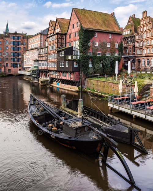 Preview: Vertical shot of the riverfront historical buildings in Stintmarkt in Lueneburg, Germany