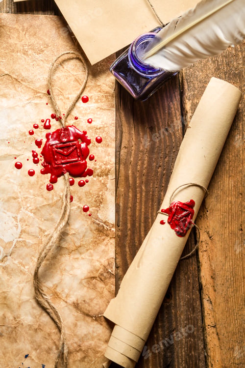 Preview: Closeup of old scrolls, sealing wax and blue ink on wooden table