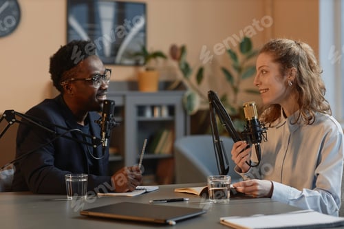 Preview: Cheerful Man and Woman Recording Podcast