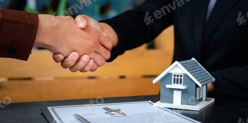 Preview: Real estate agents shaking hands To congratulate buyers after giving buyers a purchase contract, a c