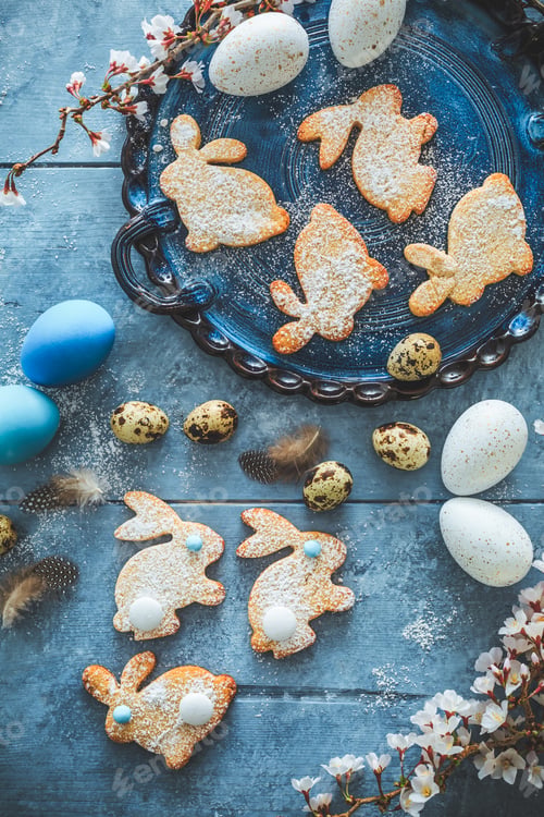 Preview: Homemade almond bunny cookies for Easter with Easter eggs in blue tone
