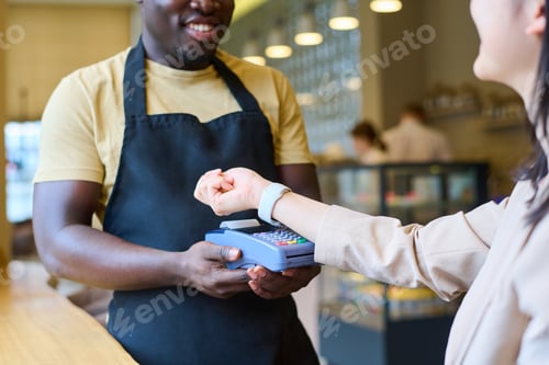 Preview: Customer using smartwatch to pay online