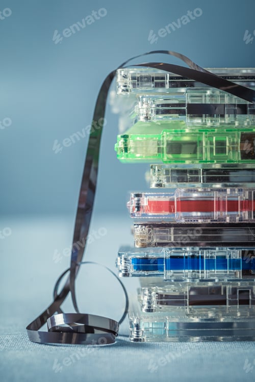 Preview: Pile of classic cassette tapes with an extracted tape