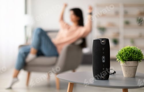 Preview: Closeup of smart portable wireless speaker on the table