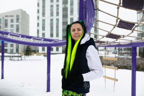 Preview: Woman Standing in Front of Purple Structure