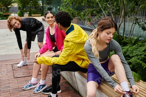 Preview: Friends enjoy a sunny day outdoors stretching and preparing for a fun sports session together
