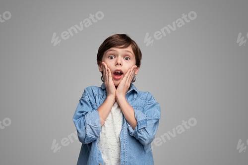 Preview: Shocked boy with hands near cheeks