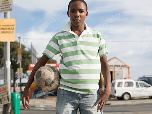 Preview: Teenage african boy with football